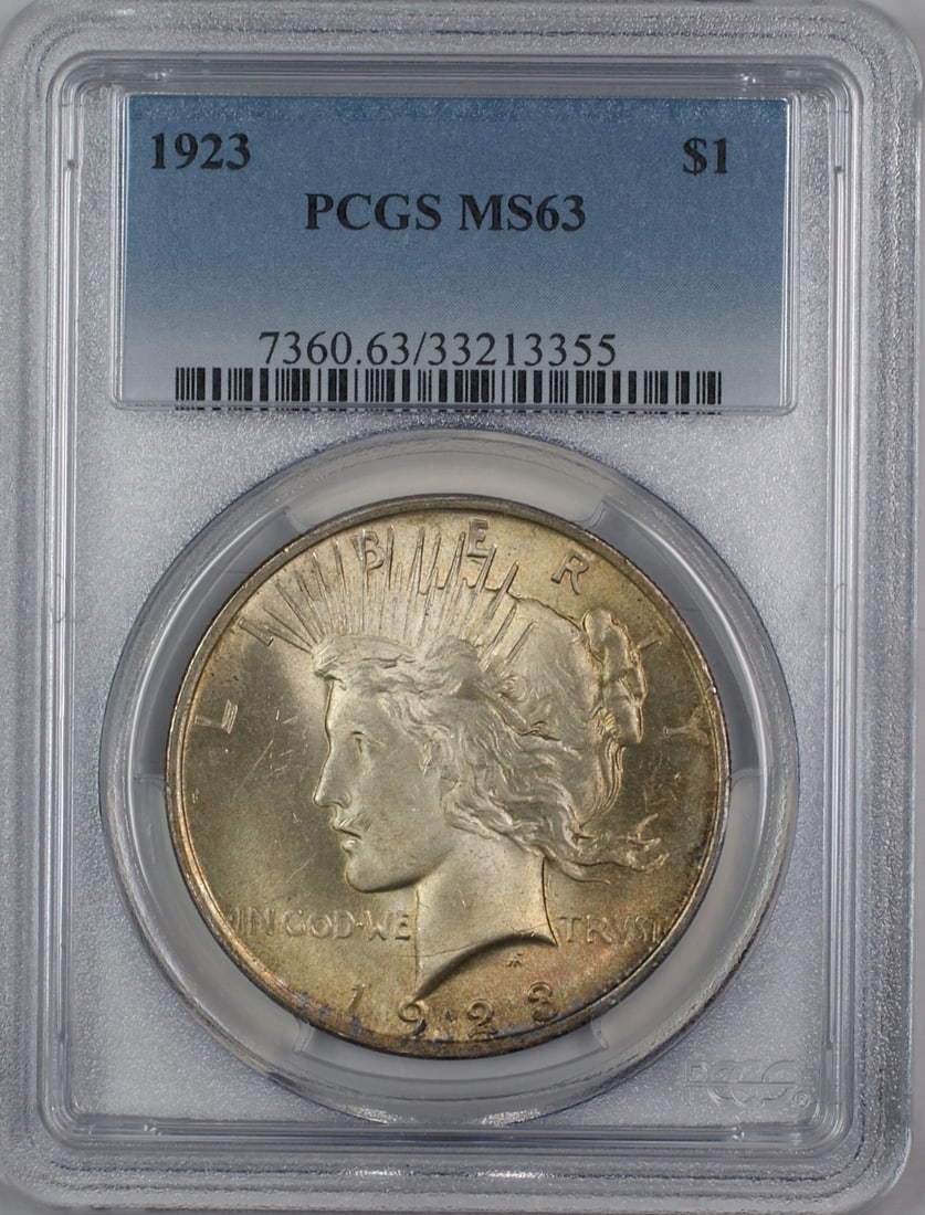 PCGS MS63 1923 Peace Silver Dollar Toned: PCGS MS63 1923 Peace Silver Dollar Toned This 1923 Silver Peace Dollar is graded MS-63 by PCGS and features attractive toning. Struck in Philadelphia, this uncirculated coin is composed of silver and 