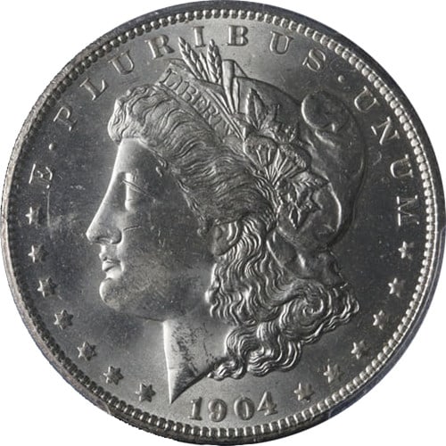 1904-O Morgan Silver Dollar PCGS MS64 Blast White Uncirculated: 1904-O Morgan Silver Dollar PCGS MS64 Blast White Uncirculated This stunning 1904-O Morgan Silver Dollar, certified by PCGS with a grade of MS64, showcases exceptional eye appeal with its fantastic lu