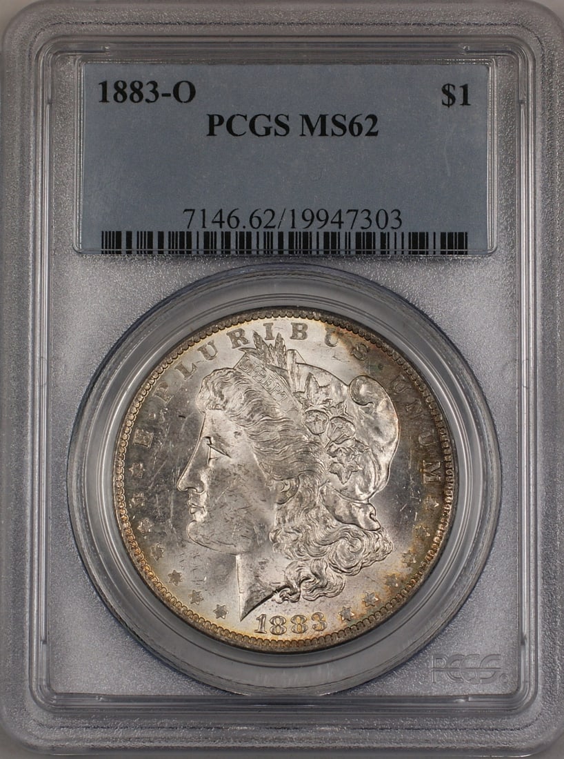 PCGS MS62 1883-O Morgan silver dollar toned: PCGS MS62 1883-O Morgan silver dollar toned This is an 1883-O Morgan Silver Dollar graded MS-62 by PCGS. The coin is uncirculated and features attractive toning. Minted in New Orleans, it is composed 