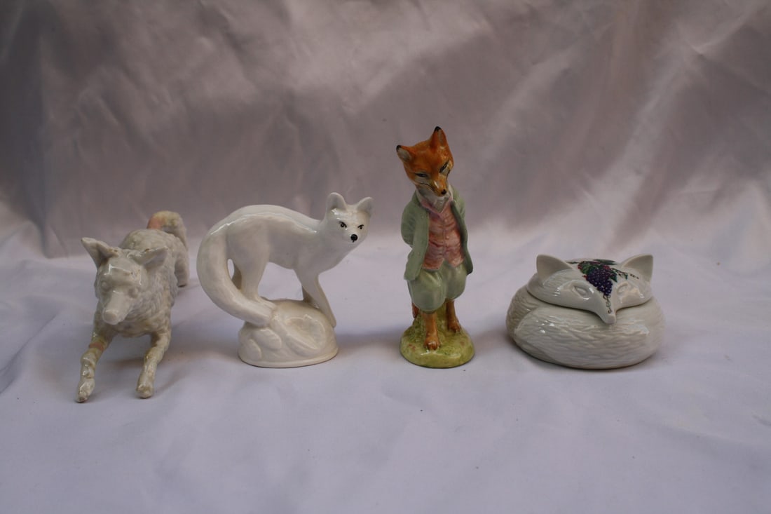 Exquisite Four-Piece Hand-Painted Porcelain Fox Figurines Set: Exquisite Four-Piece Hand-Painted Porcelain Fox Figurines Set This exquisite four-piece collection of porcelain hand-painted fox figurines showcases the artistry of various renowned manufacturers. The