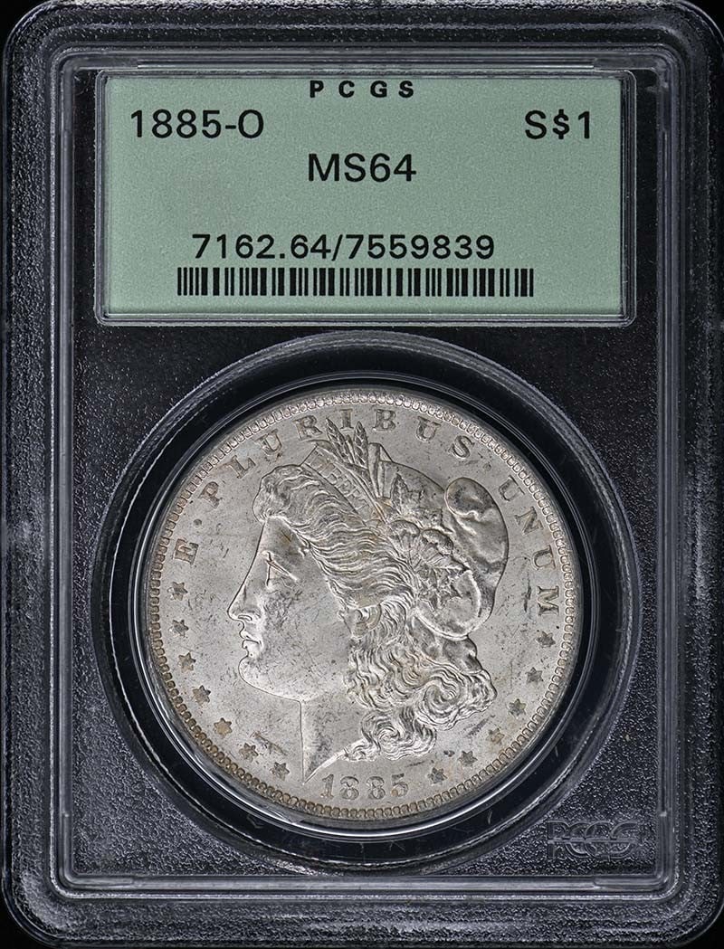 PCGS MS64 1885-O Morgan Silver Dollar: PCGS MS64 1885-O Morgan Silver Dollar This is an 1885 Morgan Dollar from the New Orleans mint, graded MS64 by PCGS and housed in an old green holder (OGH). The coin is uncirculated and originates from