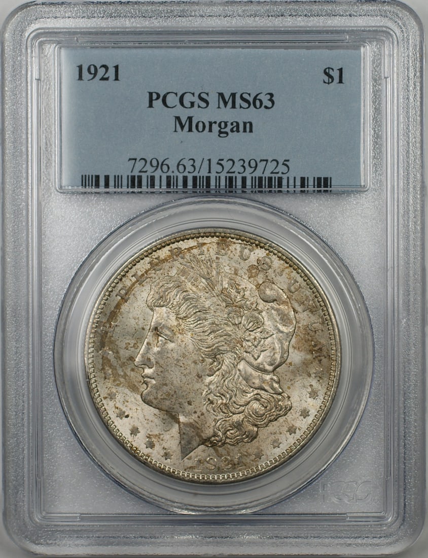 PCGS MS63 1921 Toned Morgan Dollar Silver Coin Philadelphia Issue: PCGS MS63 1921 Toned Morgan Dollar Silver Coin Philadelphia Issue This 1921 Morgan Silver Dollar is graded MS-63 by PCGS and features attractive toning. The coin was minted in Philadelphia and is comp