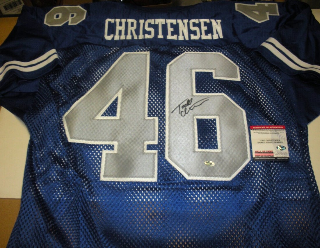 Wilson Jersey Signed by Todd Christensen with COA BYU Cougars: Wilson Jersey Signed by Todd Christensen with COA BYU Cougars This official licensed Wilson jersey is signed by Todd Christensen and features the BYU Cougars team. The jersey was used in a game and or