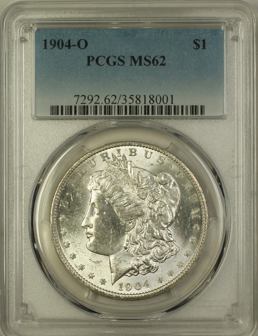 PCGS MS-62 1904-O Morgan Dollar Silver Coin from New Orleans Mint: PCGS MS-62 1904-O Morgan Dollar Silver Coin from New Orleans Mint This 1904-O Morgan Silver Dollar is a $1 coin from the United States, minted in New Orleans. Certified by PCGS and graded as MS 62, th