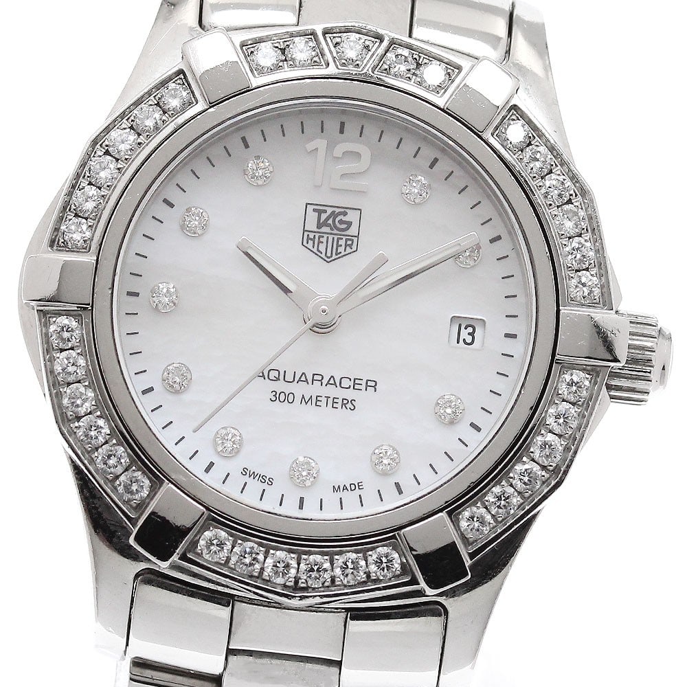 TAG Heuer Aquaracer Quartz Ladies Watch WAF1416 Diamond Bezel: TAG Heuer Aquaracer Quartz Ladies Watch WAF1416 Diamond Bezel This TAG Heuer Aquaracer WAF1416 is a women's wristwatch featuring a white mother-of-pearl dial set with 10 diamond markers and a diamond 