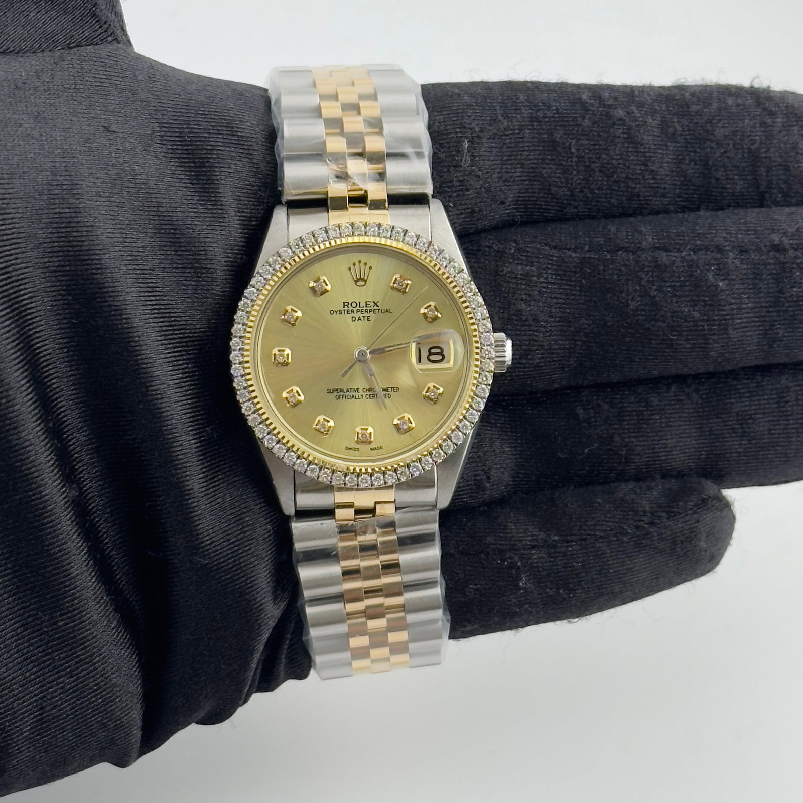 AM Champagne Diamond Dial Jubilee Watch for Rolex Date Ref 6694: AM Champagne Diamond Dial Jubilee Watch for Rolex Date Ref 6694 This Rolex Date watch features an Aftermarket champagne diamond dial and a prong plated diamond bezel. It comes with an Aftermarket Jubi