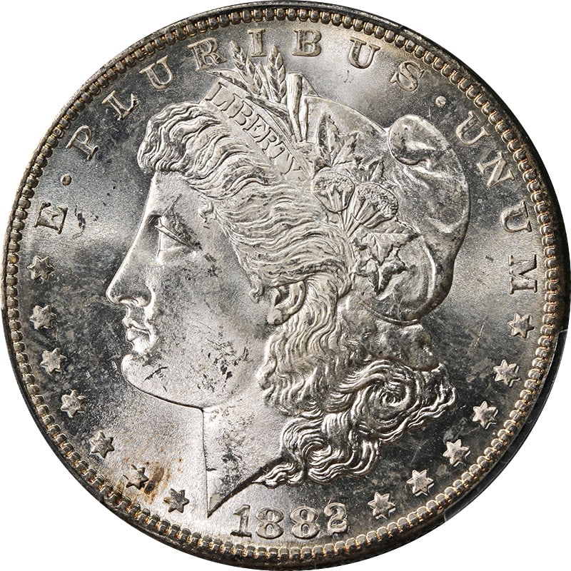 PCGS MS64 1882-S Morgan Dollar Silver Coin With Subtle Toning: PCGS MS64 1882-S Morgan Dollar Silver Coin With Subtle Toning This 1882-S Morgan Silver Dollar is graded MS64 by PCGS and features light toning. Struck at the San Francisco Mint, this uncirculated coi
