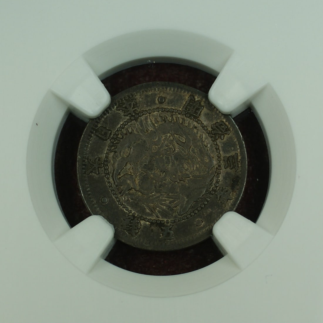 1870 Shallow Scales Japan 5 Sen Silver Coin NGC XF-45 Certified: 1870 Shallow Scales Japan 5 Sen Silver Coin NGC XF-45 Certified This is a Japan 5 Sen silver coin from the year 1870, featuring the shallow scales variety. The coin is graded XF-45 by NGC and is in ci