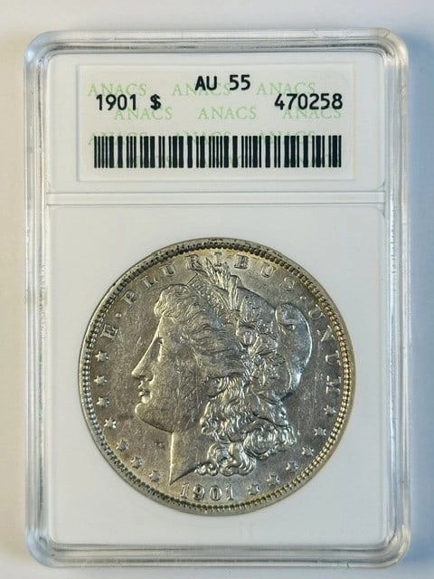 1901 Morgan Silver Dollar ANACS AU55: 1901 Morgan Silver Dollar ANACS AU55 This 1901 Morgan Silver Dollar was minted in Philadelphia and has been certified by ANACS with a grade of AU 55. Composed of silver, this pre-owned coin represents