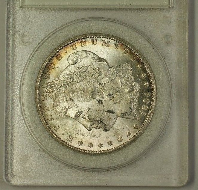 1884 Carson City Morgan Dollar Silver Coin in Encapsulated Choice Condition: 1884 Carson City Morgan Dollar Silver Coin in Encapsulated Choice Condition This 1884-CC Morgan Silver Dollar is an uncirculated collectible coin encapsulated for preservation. Minted in Carson City, 