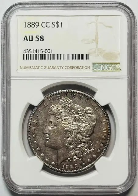 1889 Carson City Morgan Dollar NGC AU58 Proof Like: 1889 Carson City Morgan Dollar NGC AU58 Proof Like This 1889 Carson City Morgan Silver Dollar features proof-like surfaces and has been graded AU-58 by NGC. Composed of silver, this pre-owned coin ori