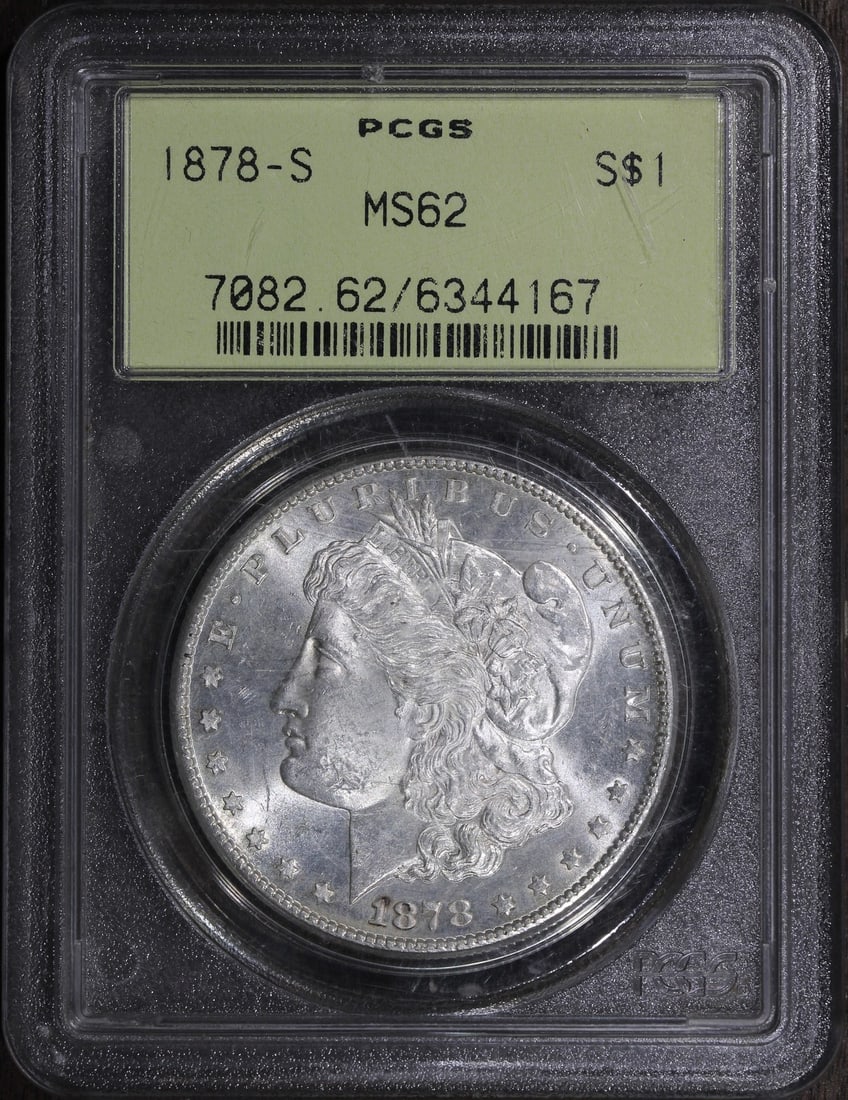 PCGS MS62 1878-S Morgan Silver Dollar First Year Issue: PCGS MS62 1878-S Morgan Silver Dollar First Year Issue An 1878 Morgan Silver Dollar $1, graded MS62 by PCGS and described as a first-year issue. The coin is uncirculated, made of silver with 0.9 finen