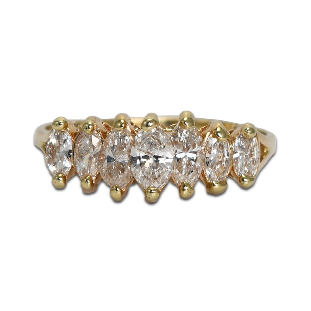 Marquise Diamond Cluster Ring 14K Yellow Gold Size 8.5: Marquise Diamond Cluster Ring 14K Yellow Gold Size 8.5 This elegant cluster ring features seven marquise-shaped diamonds set in 14K yellow gold. The diamonds have a total carat weight of approximately