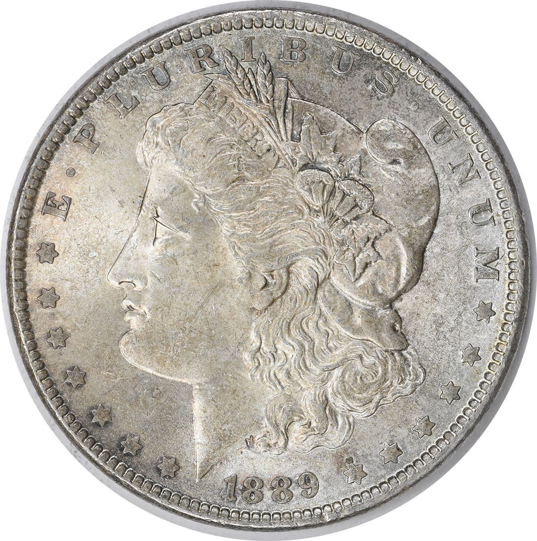 Choice BU 1889 Uncertified Morgan Dollar Silver Coin With Toning: Choice BU 1889 Uncertified Morgan Dollar Silver Coin With Toning This 1889 Morgan Silver Dollar is an uncirculated, choice brilliant uncirculated (BU) coin featuring attractive toning. Struck in silve