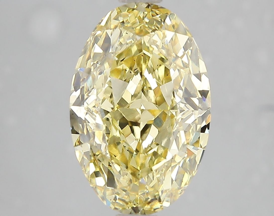 Loose Diamond - OVAL 5.1ct Fancy Vivid Yellow VS2: Loose Diamond - OVAL 5.1ct Fancy Vivid Yellow VS2 Source: This is a real non-mined Diamond that has been grown in a lab Shape: OVAL Carats: 5.1 Color: Fancy Vivid Yellow Certification: IGI Video: