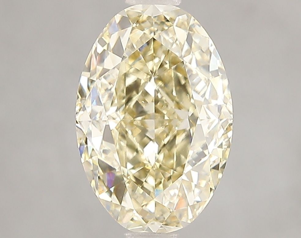 Loose Diamond - OVAL 3.1ct Fancy Yellow VS1: Loose Diamond - OVAL 3.1ct Fancy Yellow VS1 Source: This is a real non-mined Diamond that has been grown in a lab Shape: OVAL Carats: 3.1 Color: Fancy Yellow Certification: IGI Video: