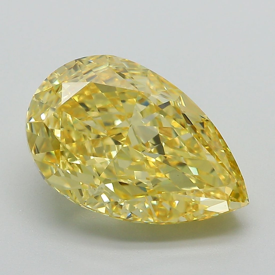 Loose Diamond - PEAR 6.14ct Fancy Vivid Yellow VS1: Loose Diamond - PEAR 6.14ct Fancy Vivid Yellow VS1 Source: This is a real non-mined Diamond that has been grown in a lab Shape: PEAR Carats: 6.14 Color: Fancy Vivid Yellow Certification: IGI Video: