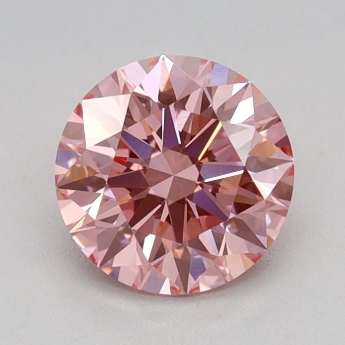 Ideal Loose Diamond - ROUND 0.71ct Fancy Vivid Pink VS1: Ideal Loose Diamond - ROUND 0.71ct Fancy Vivid Pink VS1 Source: This is a real non-mined Diamond that has been grown in a lab Shape: ROUND Carats: 0.71 Color: Fancy Vivid Pink Certification: IGI Video