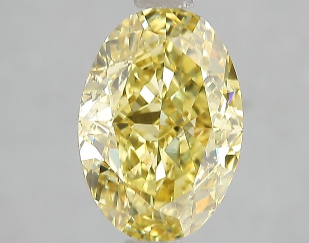 Loose Diamond - OVAL 3.02ct Fancy Vivid Yellow VS2: Loose Diamond - OVAL 3.02ct Fancy Vivid Yellow VS2 Source: This is a real non-mined Diamond that has been grown in a lab Shape: OVAL Carats: 3.02 Color: Fancy Vivid Yellow Certification: IGI Video: