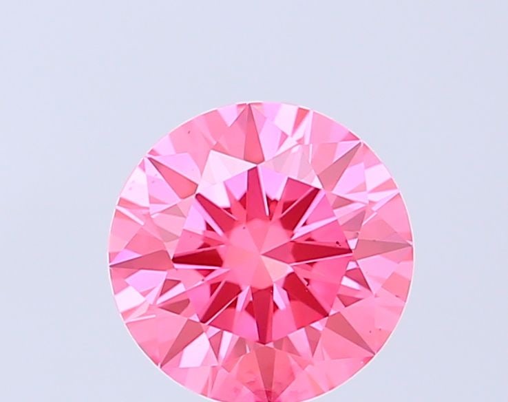 Ideal Loose Diamond - ROUND 1.04ct Fancy Vivid Pink VS2: Ideal Loose Diamond - ROUND 1.04ct Fancy Vivid Pink VS2 Source: This is a real non-mined Diamond that has been grown in a lab Shape: ROUND Carats: 1.04 Color: Fancy Vivid Pink Certification: IGI Video