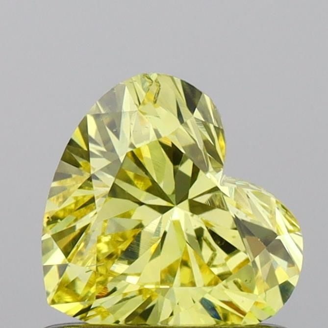 Loose Diamond - HEART 0.67ct Fancy Vivid Yellow SI1: Loose Diamond - HEART 0.67ct Fancy Vivid Yellow SI1 Source: This is a real non-mined Diamond that has been grown in a lab Shape: HEART Carats: 0.67 Color: Fancy Vivid Yellow Certification: IGI Video:
