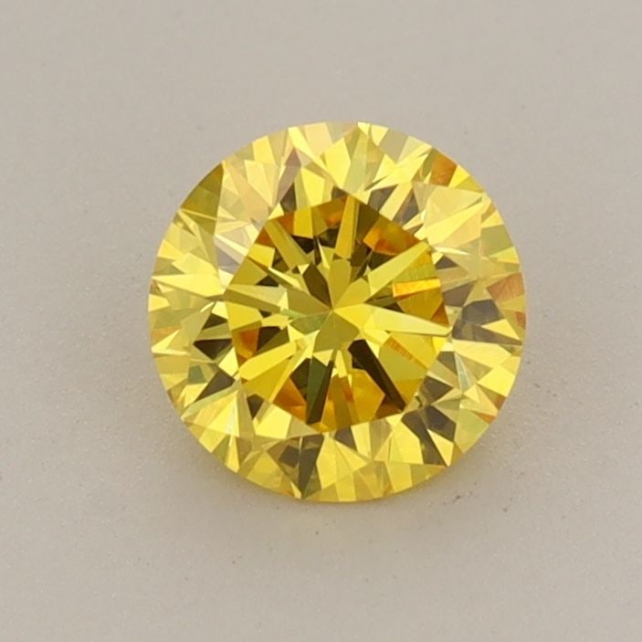 Loose Diamond - ROUND 0.69ct Fancy Vivid Yellow VVS2: Loose Diamond - ROUND 0.69ct Fancy Vivid Yellow VVS2 Source: This is a real non-mined Diamond that has been grown in a lab Shape: ROUND Carats: 0.69 Color: Fancy Vivid Yellow Certification: IGI Video: