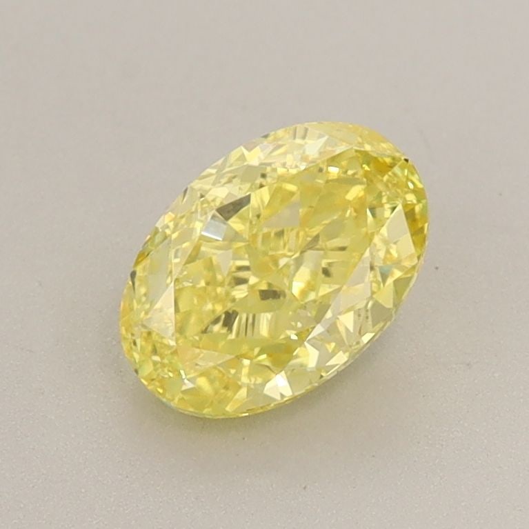 Loose Diamond - OVAL 1.02ct Fancy Vivid Yellow VS2: Loose Diamond - OVAL 1.02ct Fancy Vivid Yellow VS2 Source: This is a real non-mined Diamond that has been grown in a lab Shape: OVAL Carats: 1.02 Color: Fancy Vivid Yellow Certification: IGI Video: