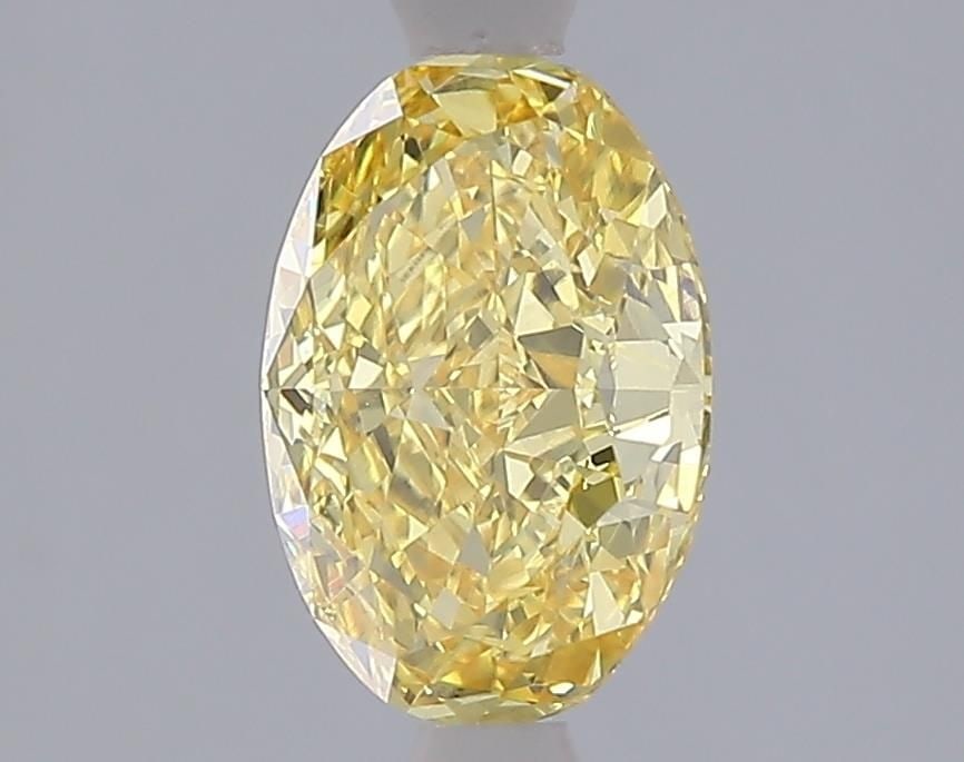 Loose Diamond - OVAL 1.58ct Fancy Vivid Yellow VVS2: Loose Diamond - OVAL 1.58ct Fancy Vivid Yellow VVS2 Source: This is a real non-mined Diamond that has been grown in a lab Shape: OVAL Carats: 1.58 Color: Fancy Vivid Yellow Certification: IGI Video: