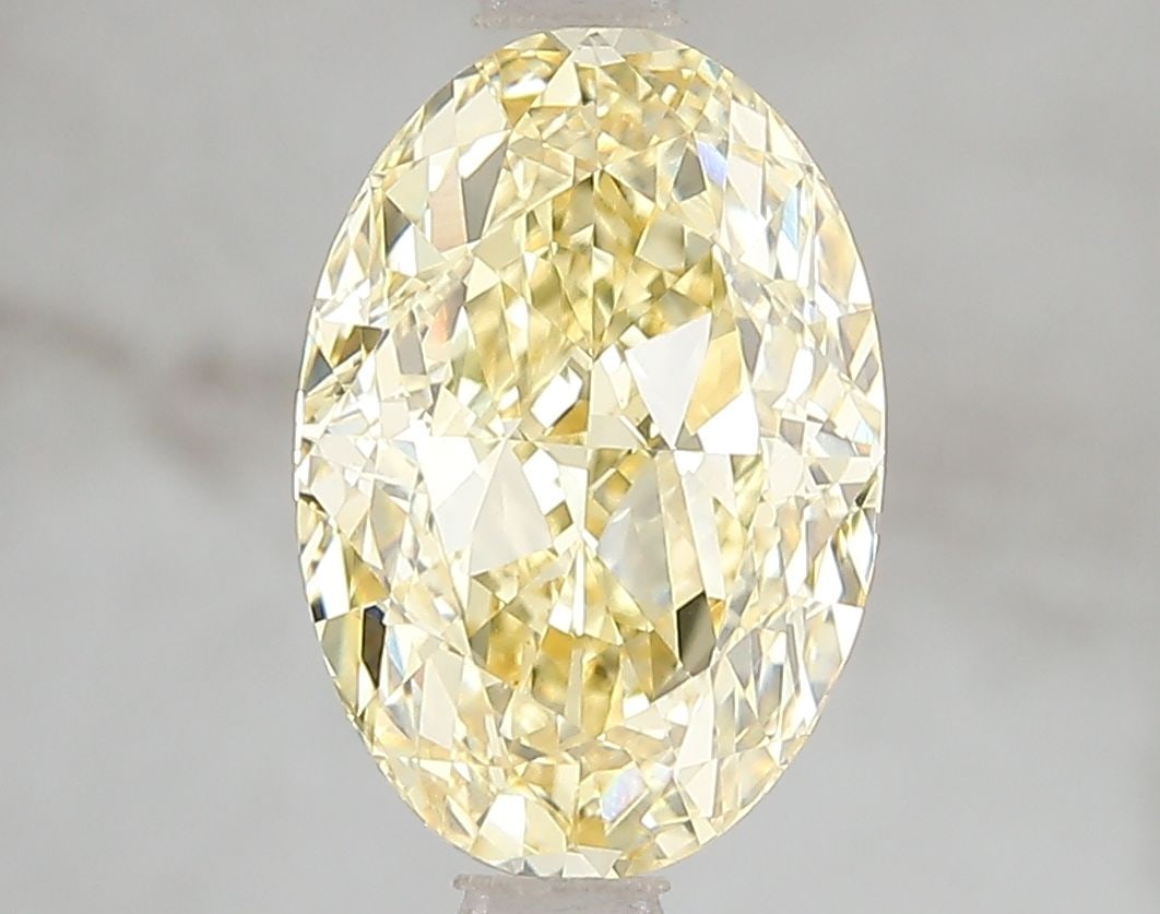 Loose Diamond - OVAL 3.03ct Fancy Vivid Yellow VVS2: Loose Diamond - OVAL 3.03ct Fancy Vivid Yellow VVS2 Source: This is a real non-mined Diamond that has been grown in a lab Shape: OVAL Carats: 3.03 Color: Fancy Vivid Yellow Certification: IGI Video: