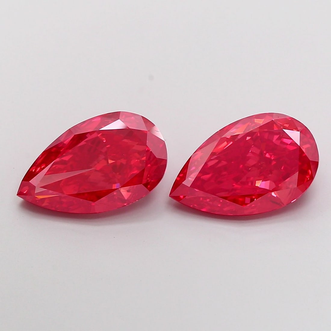 Loose Diamond - PEAR 5.02ct Fancy Vivid Red VVS2: Loose Diamond - PEAR 5.02ct Fancy Vivid Red VVS2 Source: This is a real non-mined Diamond that has been grown in a lab Shape: PEAR Carats: 5.02 Color: Fancy Vivid Red Certification: IGI Video:
