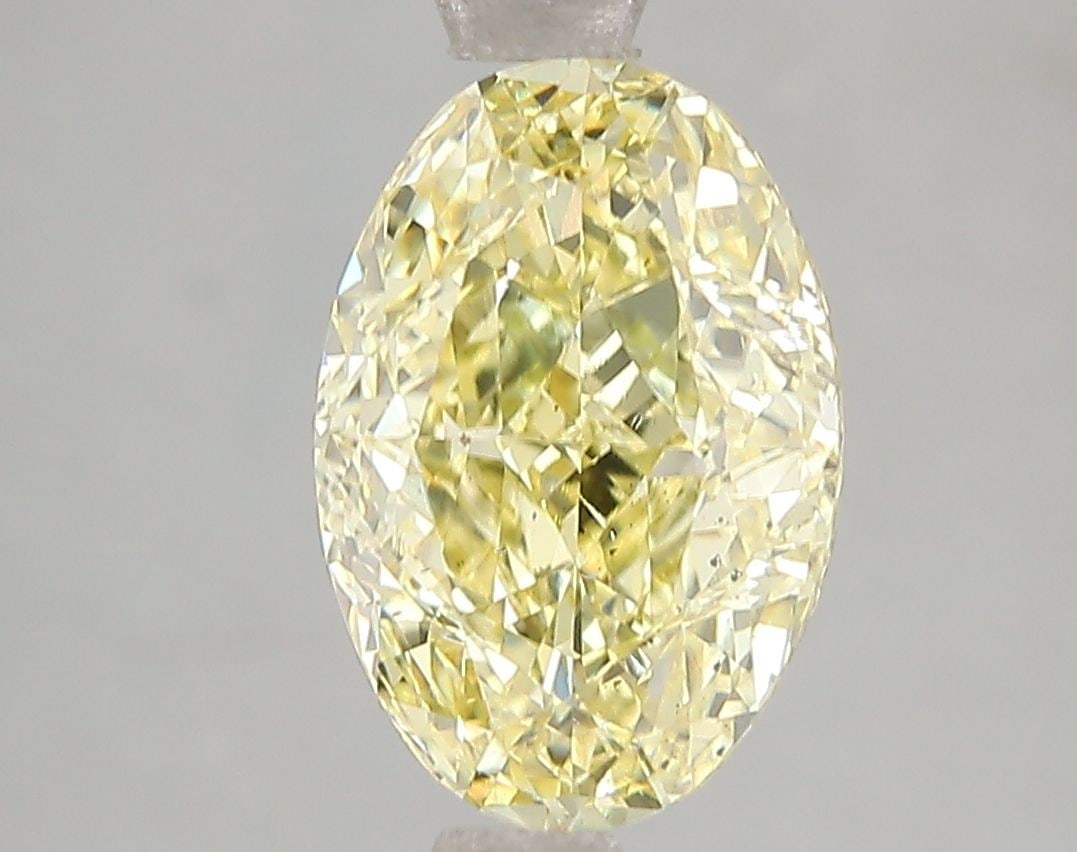 Loose Diamond - OVAL 3.02ct Fancy Vivid Yellow SI1: Loose Diamond - OVAL 3.02ct Fancy Vivid Yellow SI1 Source: This is a real non-mined Diamond that has been grown in a lab Shape: OVAL Carats: 3.02 Color: Fancy Vivid Yellow Certification: IGI Video: