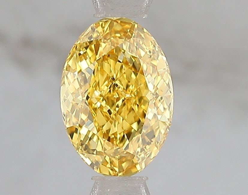 Loose Diamond - OVAL 1.02ct Fancy Vivid Yellow VS2: Loose Diamond - OVAL 1.02ct Fancy Vivid Yellow VS2 Source: This is a real non-mined Diamond that has been grown in a lab Shape: OVAL Carats: 1.02 Color: Fancy Vivid Yellow Certification: IGI Video: