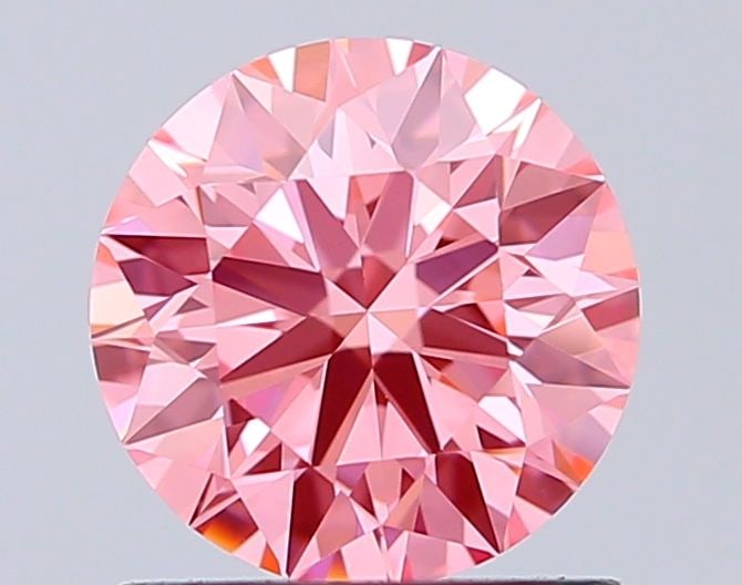 Ideal Loose Diamond - ROUND 1.04ct Fancy Vivid Pink VVS2: Ideal Loose Diamond - ROUND 1.04ct Fancy Vivid Pink VVS2 Source: This is a real non-mined Diamond that has been grown in a lab Shape: ROUND Carats: 1.04 Color: Fancy Vivid Pink Certification: IGI Vide
