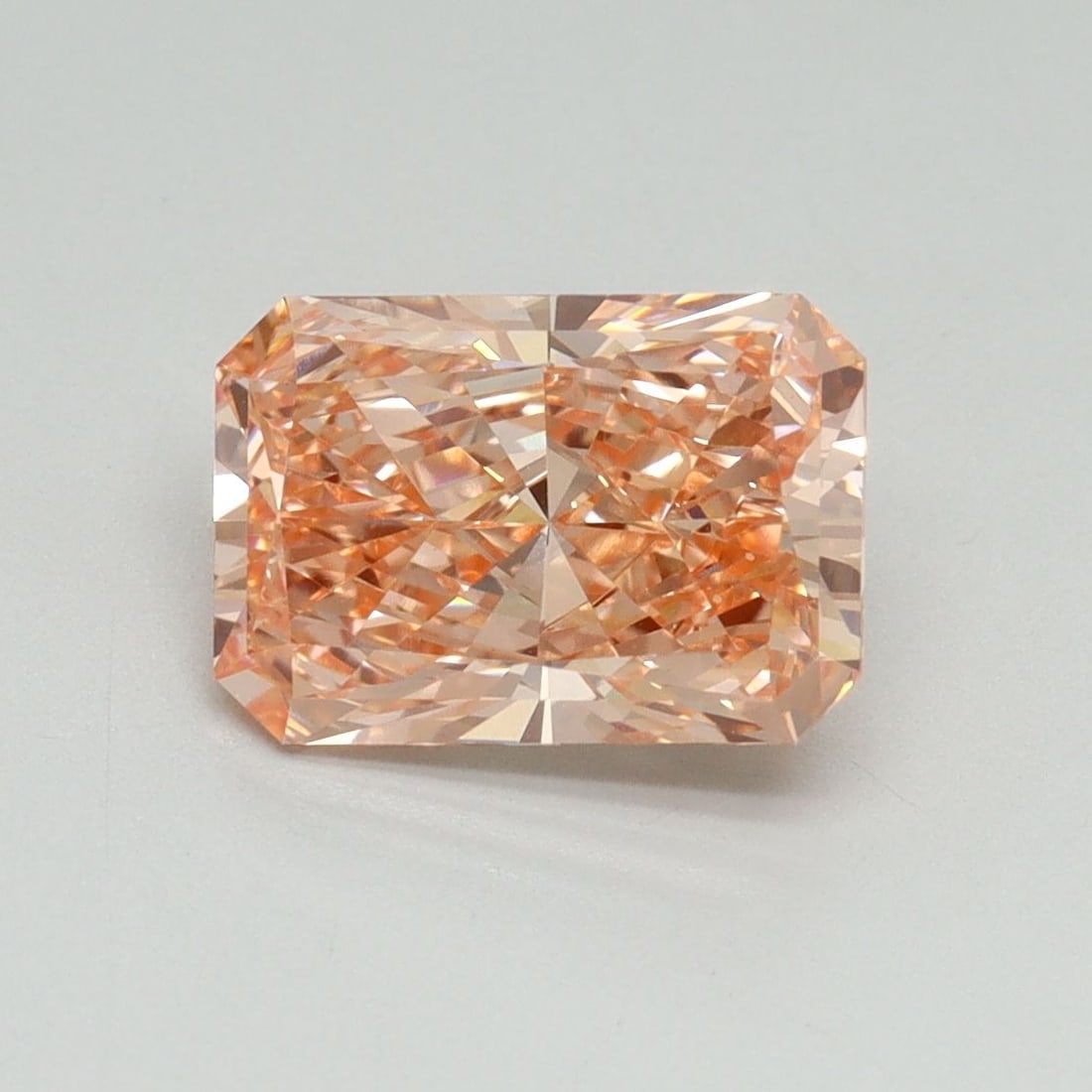 Loose Diamond - RADIANT 2.02ct Fancy Vivid Orangey Pink VVS2: Loose Diamond - RADIANT 2.02ct Fancy Vivid Orangey Pink VVS2 Source: This is a real non-mined Diamond that has been grown in a lab Shape: RADIANT Carats: 2.02 Color: Fancy Vivid Orangey Pink Certifica