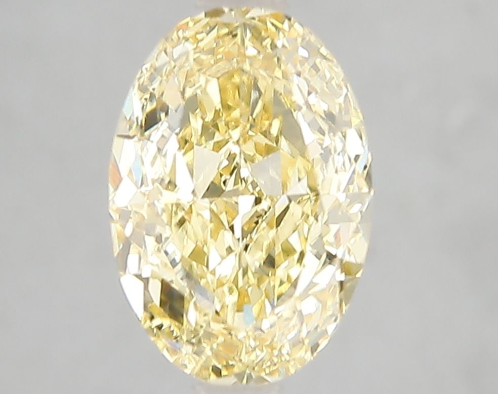 Loose Diamond - OVAL 3.02ct Fancy Vivid Yellow VS2: Loose Diamond - OVAL 3.02ct Fancy Vivid Yellow VS2 Source: This is a real non-mined Diamond that has been grown in a lab Shape: OVAL Carats: 3.02 Color: Fancy Vivid Yellow Certification: IGI Video: