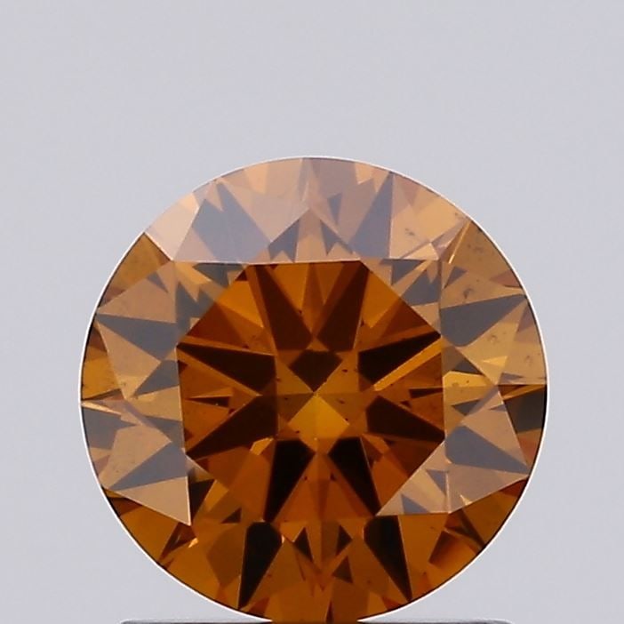 Loose Diamond - ROUND 1.06ct Fancy Vivid Orange VS2: Loose Diamond - ROUND 1.06ct Fancy Vivid Orange VS2 Source: This is a real non-mined Diamond that has been grown in a lab Shape: ROUND Carats: 1.06 Color: Fancy Vivid Orange Certification: IGI Video: