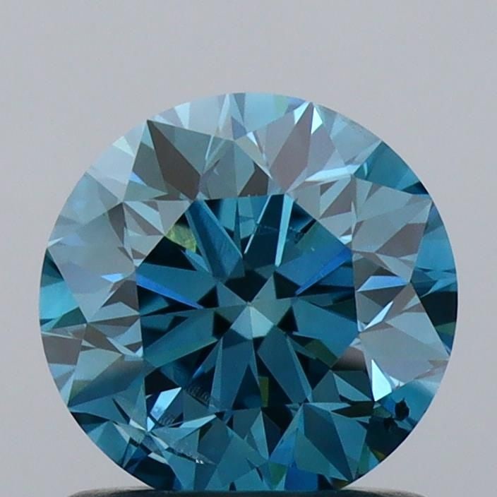 Loose Diamond - ROUND 1.03ct Fancy Vivid Blue SI2: Loose Diamond - ROUND 1.03ct Fancy Vivid Blue SI2 Source: This is a real non-mined Diamond that has been grown in a lab Shape: ROUND Carats: 1.03 Color: Fancy Vivid Blue Certification: IGI Video: