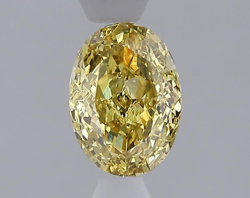 Loose Diamond - OVAL 1.08ct Fancy Vivid Yellow VVS2: Loose Diamond - OVAL 1.08ct Fancy Vivid Yellow VVS2 Source: This is a real non-mined Diamond that has been grown in a lab Shape: OVAL Carats: 1.08 Color: Fancy Vivid Yellow Certification: IGI Video: