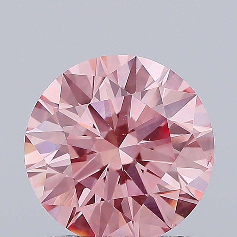 Ideal Loose Diamond - ROUND 1.42ct Fancy Vivid Pink VS2: Ideal Loose Diamond - ROUND 1.42ct Fancy Vivid Pink VS2 Source: This is a real non-mined Diamond that has been grown in a lab Shape: ROUND Carats: 1.42 Color: Fancy Vivid Pink Certification: IGI Video