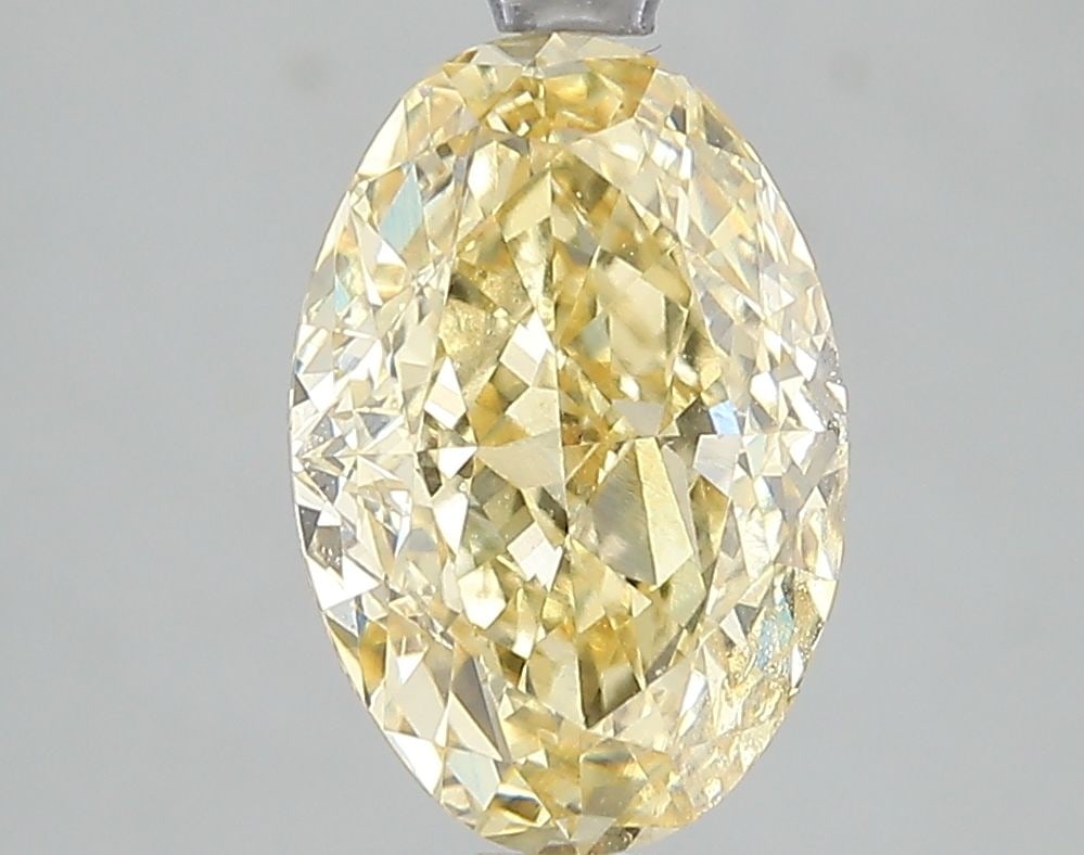 Loose Diamond - OVAL 3.1ct Fancy Intense Yellow VVS2: Loose Diamond - OVAL 3.1ct Fancy Intense Yellow VVS2 Source: This is a real non-mined Diamond that has been grown in a lab Shape: OVAL Carats: 3.1 Color: Fancy Intense Yellow Certification: IGI Video: