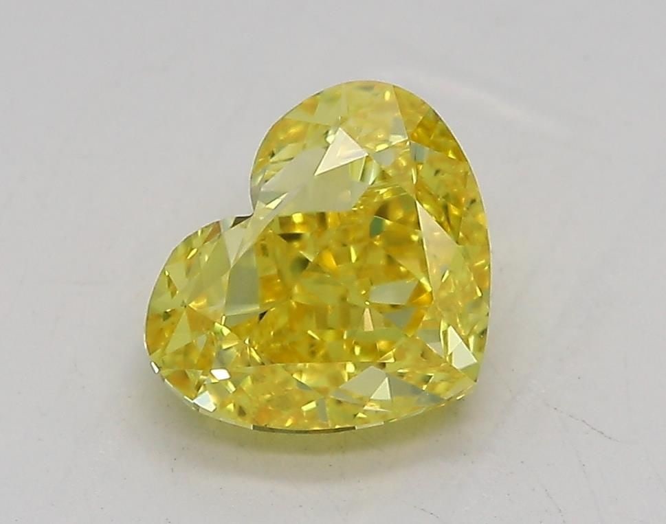 Loose Diamond - HEART 1.41ct Fancy Vivid Yellow VVS2: Loose Diamond - HEART 1.41ct Fancy Vivid Yellow VVS2 Source: This is a real non-mined Diamond that has been grown in a lab Shape: HEART Carats: 1.41 Color: Fancy Vivid Yellow Certification: IGI Video: