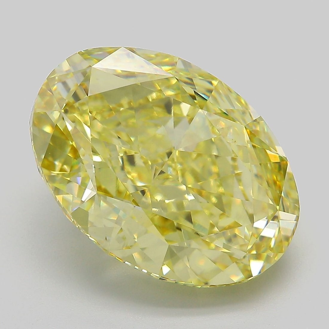 Loose Diamond - OVAL 11.97ct Fancy Intense Yellow VVS2: Loose Diamond - OVAL 11.97ct Fancy Intense Yellow VVS2 Source: This is a real non-mined Diamond that has been grown in a lab Shape: OVAL Carats: 11.97 Color: Fancy Intense Yellow Certification: IGI Vi