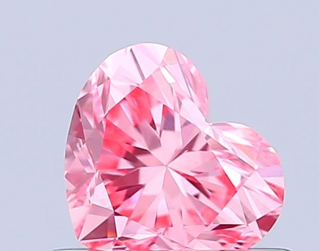 Loose Diamond - HEART 0.56ct Fancy Vivid Pink VVS2: Loose Diamond - HEART 0.56ct Fancy Vivid Pink VVS2 Source: This is a real non-mined Diamond that has been grown in a lab Shape: HEART Carats: 0.56 Color: Fancy Vivid Pink Certification: IGI Video: