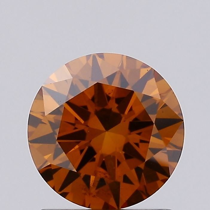 Loose Diamond - ROUND 1.04ct Fancy Vivid Orange VS2: Loose Diamond - ROUND 1.04ct Fancy Vivid Orange VS2 Source: This is a real non-mined Diamond that has been grown in a lab Shape: ROUND Carats: 1.04 Color: Fancy Vivid Orange Certification: IGI Video:
