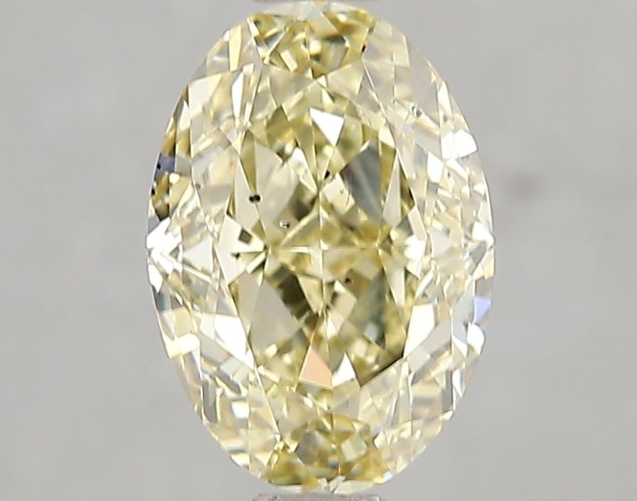 Loose Diamond - OVAL 2.06ct Fancy Yellow SI1: Loose Diamond - OVAL 2.06ct Fancy Yellow SI1 Source: This is a real non-mined Diamond that has been grown in a lab Shape: OVAL Carats: 2.06 Color: Fancy Yellow Certification: IGI Video: