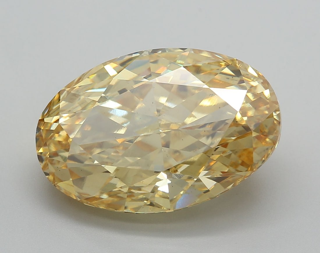Loose Diamond - OVAL 12.05ct Fancy Vivid Yellow VS2: Loose Diamond - OVAL 12.05ct Fancy Vivid Yellow VS2 Source: This is a real non-mined Diamond that has been grown in a lab Shape: OVAL Carats: 12.05 Color: Fancy Vivid Yellow Certification: IGI Video: