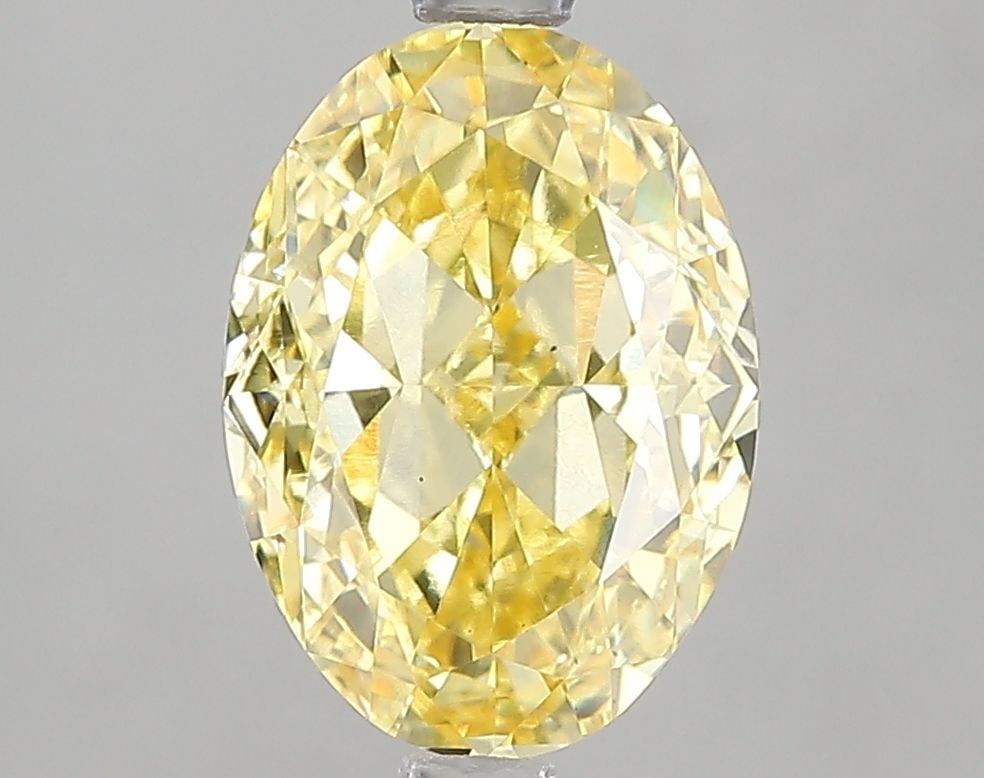 Loose Diamond - OVAL 3.03ct Fancy Vivid Yellow VS1: Loose Diamond - OVAL 3.03ct Fancy Vivid Yellow VS1 Source: This is a real non-mined Diamond that has been grown in a lab Shape: OVAL Carats: 3.03 Color: Fancy Vivid Yellow Certification: IGI Video: