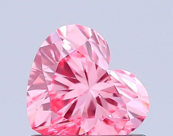 Loose Diamond - HEART 0.78ct Fancy Vivid Pink VVS2: Loose Diamond - HEART 0.78ct Fancy Vivid Pink VVS2 Source: This is a real non-mined Diamond that has been grown in a lab Shape: HEART Carats: 0.78 Color: Fancy Vivid Pink Certification: IGI Video: