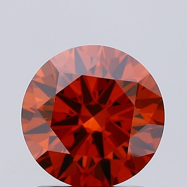 Loose Diamond - ROUND 1.43ct Fancy Vivid Orange VS1: Loose Diamond - ROUND 1.43ct Fancy Vivid Orange VS1 Source: This is a real non-mined Diamond that has been grown in a lab Shape: ROUND Carats: 1.43 Color: Fancy Vivid Orange Certification: IGI Video: