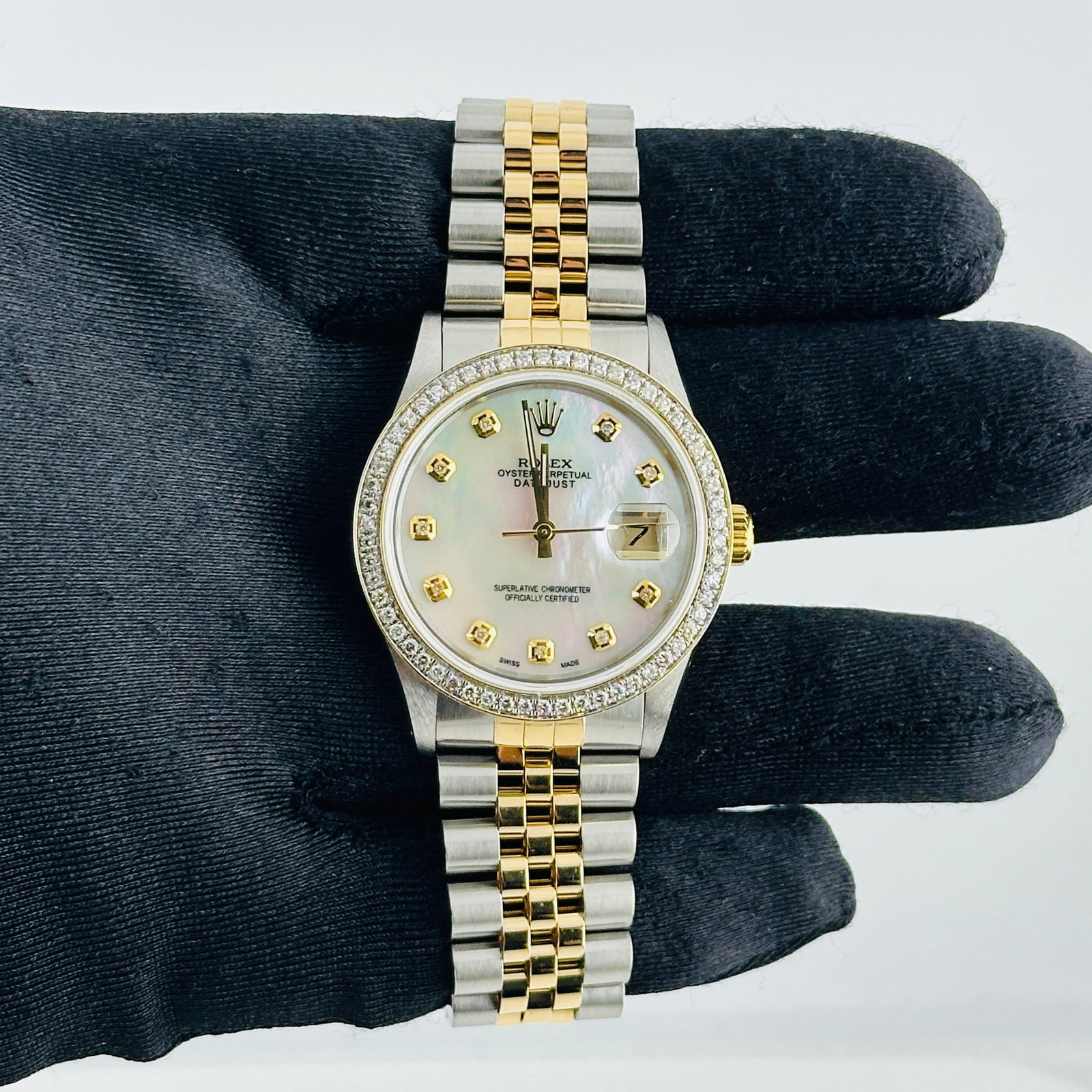 Rolex Aftermarket White MOP Diamond Dial for Datejust 16013 D-Link Jubilee: Rolex Aftermarket White MOP Diamond Dial for Datejust 16013 D-Link Jubilee This Rolex Datejust features an aftermarket white mother-of-pearl diamond dial and a pave 10K diamond bezel. It comes with a 